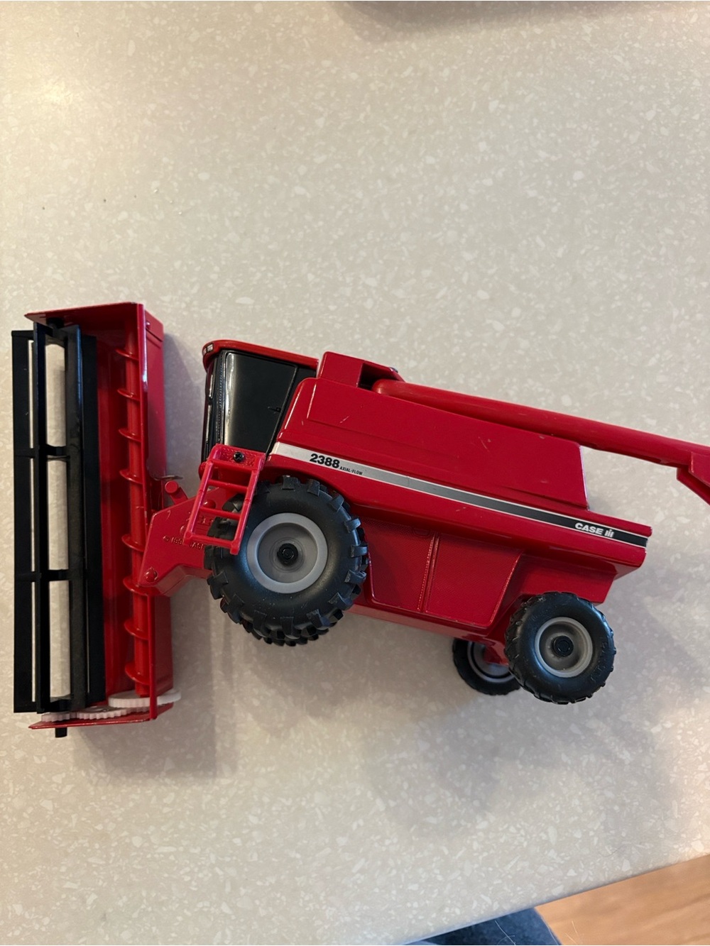 A 1/32 scale ERTL Case IH 2388 Axial-Flow Combine die-cast farm toy replica.